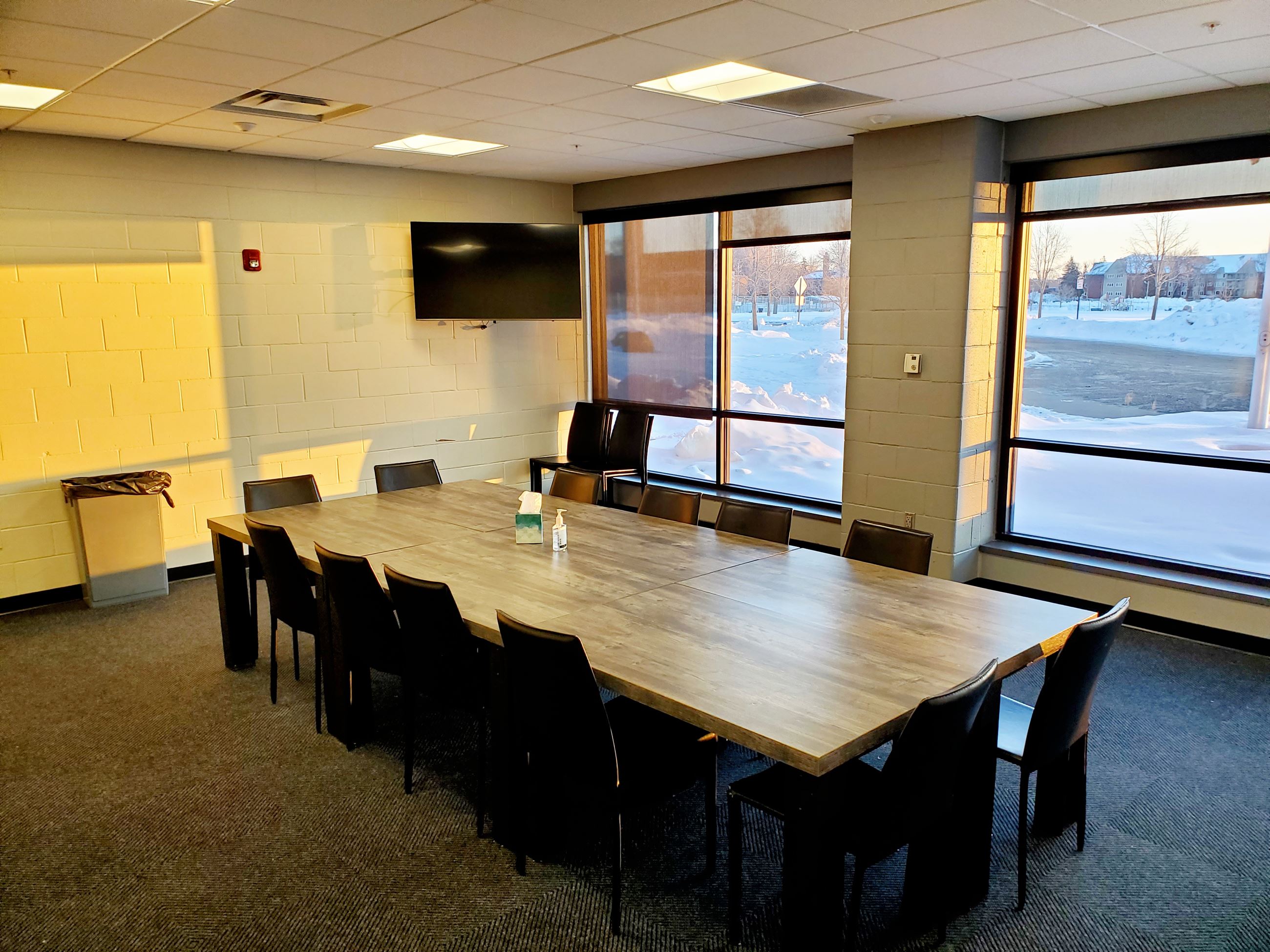 A table and chairs set up in the Pavilion Meeting Room 101