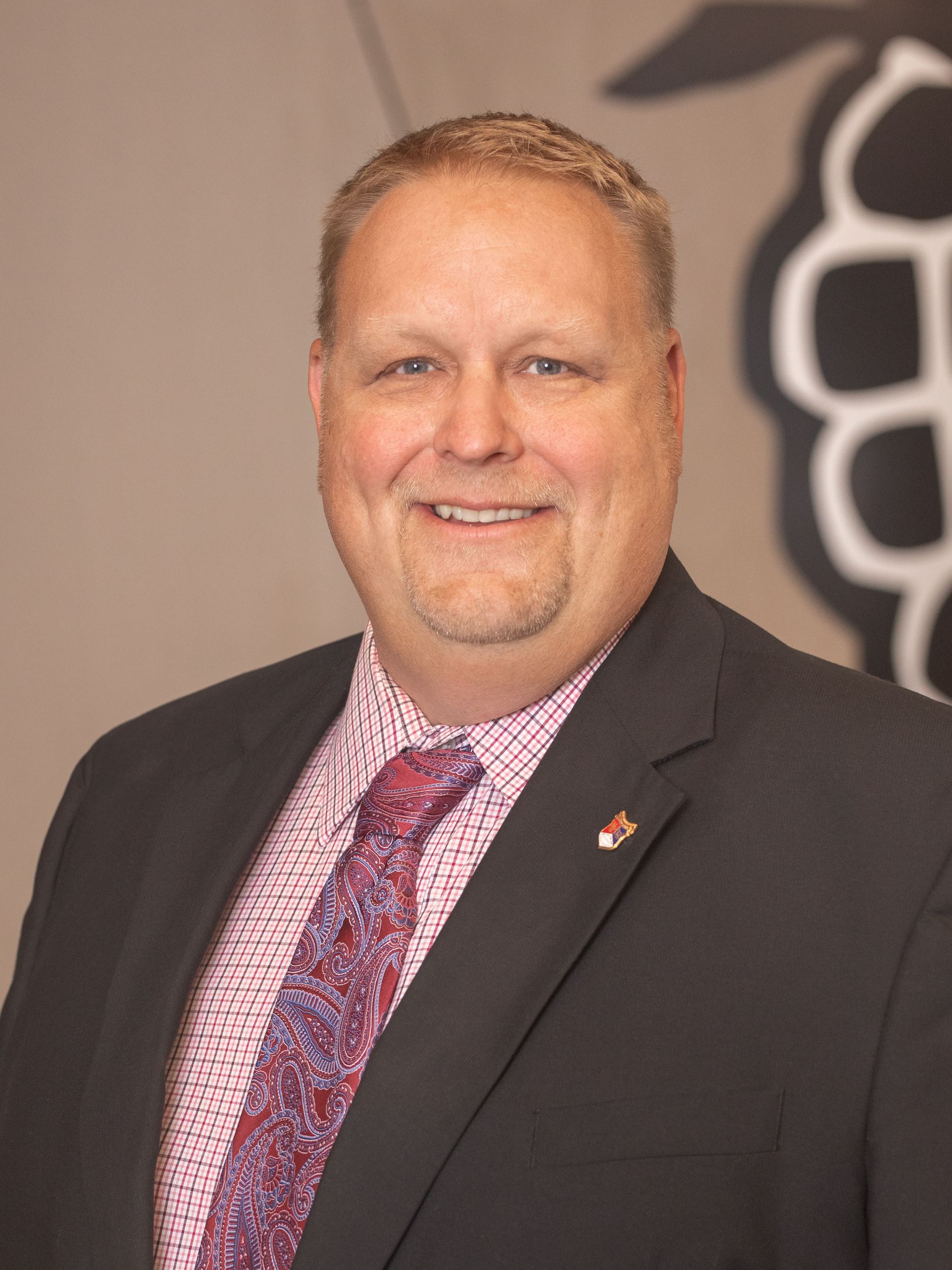 A portrait of 2024 city council member Aaron Kuznia